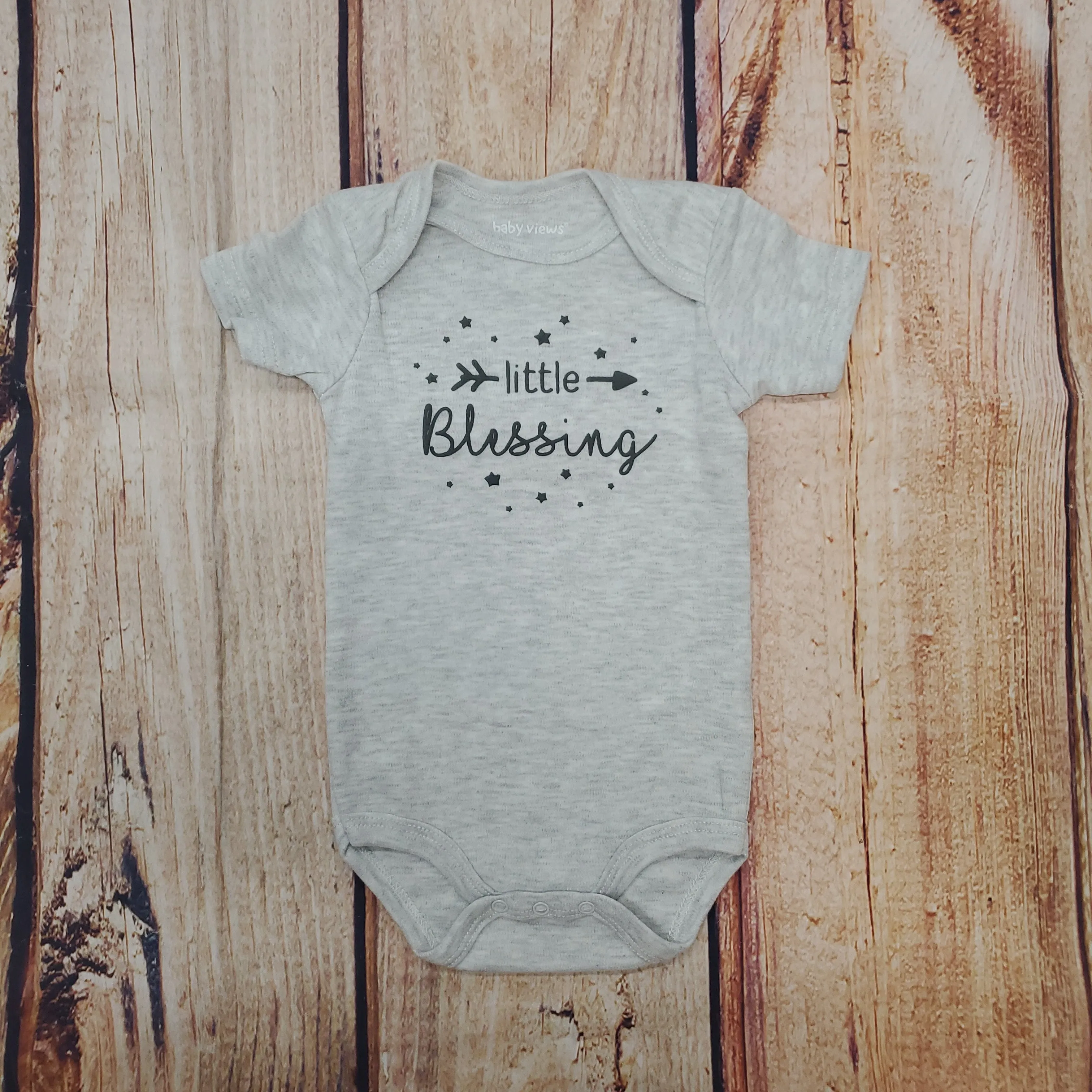 KELLIS LITTLE BLESSING ONESIE